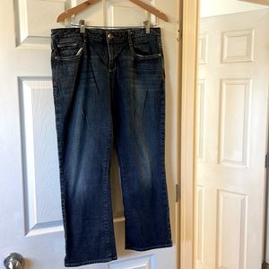 women’s jeans, blue baggier cut midrise